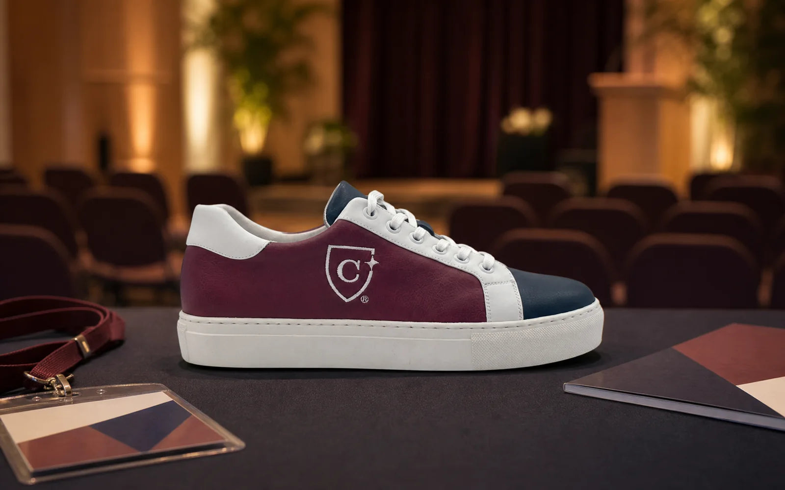 Custom university sneaker presented in a memorable event setting