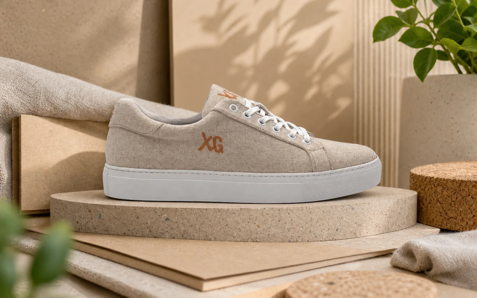 Sustainable custom linen sneaker displayed with natural campaign materials