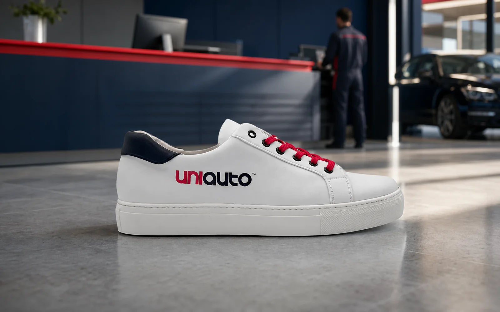 Custom UniAuto sneaker in a professional automotive workplace